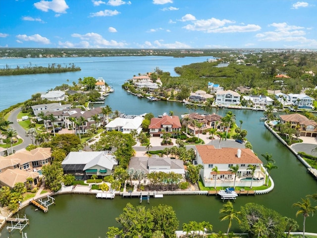 aerial perspective of suburban area with a nearby body of water