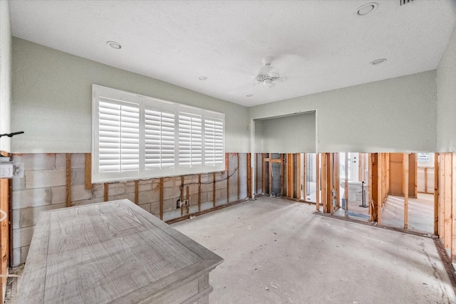spare room with concrete flooring and plenty of natural light