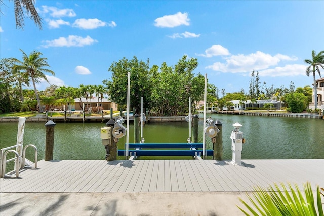 dock area with a water view and boat lift