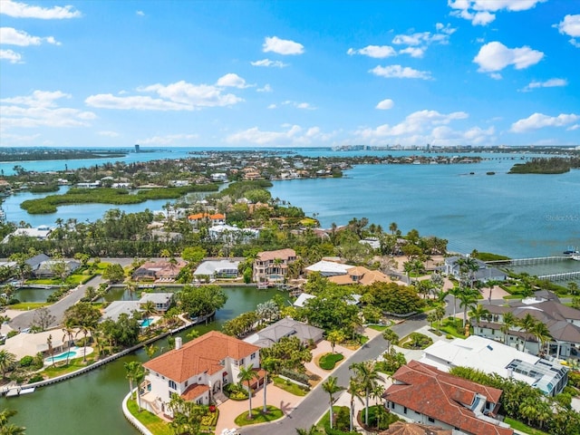 aerial view of residential area featuring a nearby body of water