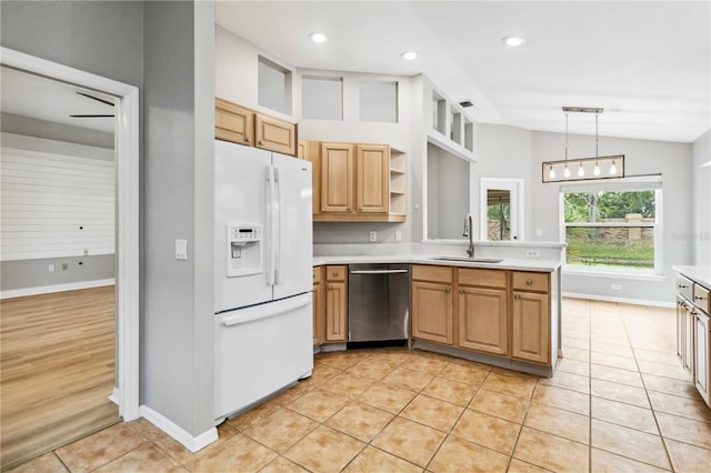 kitchen with stainless steel dishwasher, white fridge with ice dispenser, a sink, vaulted ceiling, and light countertops