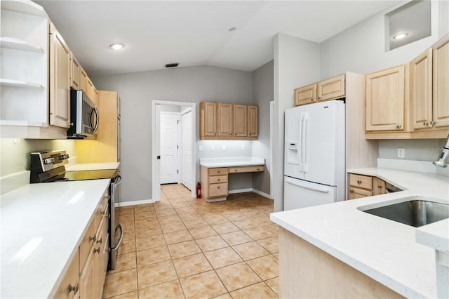kitchen featuring stainless steel appliances, light brown cabinetry, lofted ceiling, a sink, and light countertops