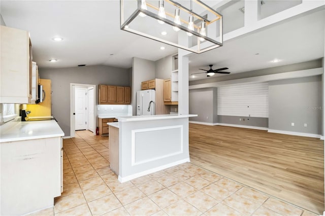 kitchen with ceiling fan, light tile patterned floors, stove, light countertops, and recessed lighting