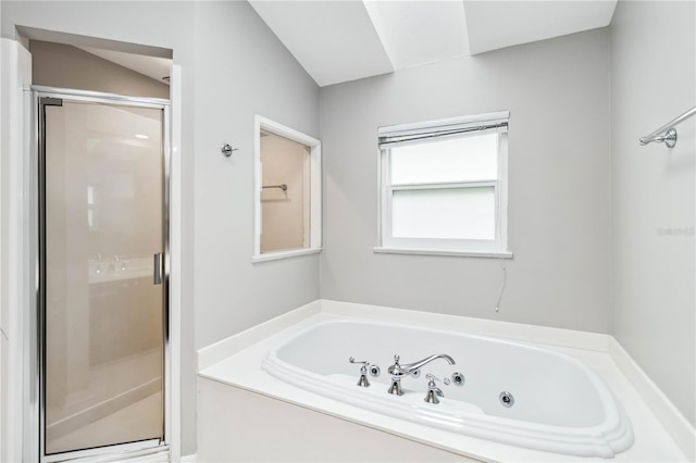 full bath featuring a jetted tub and a stall shower