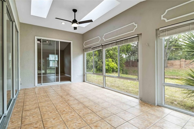 unfurnished sunroom with a skylight