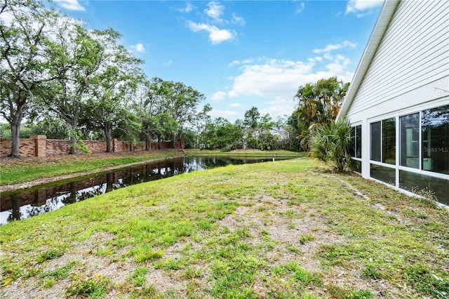 view of yard with a water view