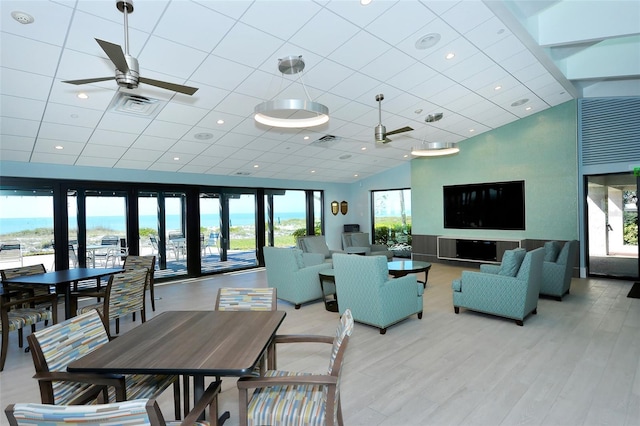 2045 Gulf Of Mexico Dr Unit M1-302, Longboat Key, FL 34228 - dining area with a ceiling fan, wood finished floors, and a drop ceiling