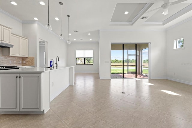kitchen with open floor plan, crown molding, light tile patterned floors, and recessed lighting