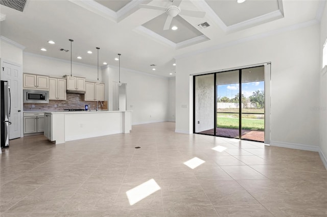 unfurnished living room featuring a sink, ornamental molding, coffered ceiling, recessed lighting, and a ceiling fan