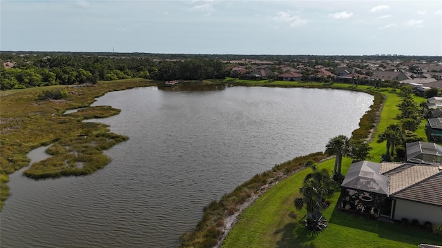 aerial view of residential area featuring a nearby body of water