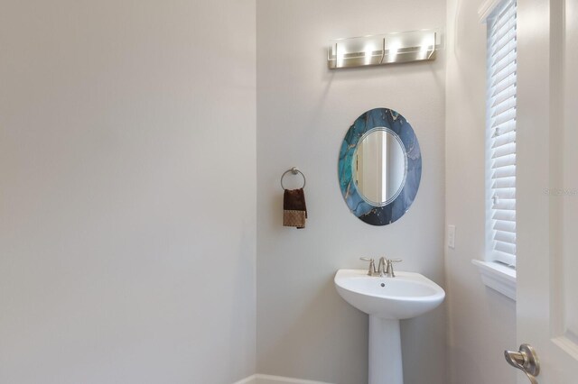 8191 Gabanna Dr, Sarasota, FL 34231 - bathroom featuring a sink and baseboards