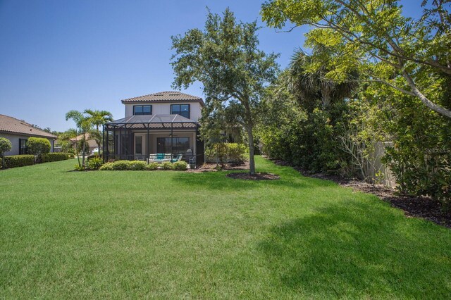 8191 Gabanna Dr, Sarasota, FL 34231 - view of grassy yard featuring glass enclosure
