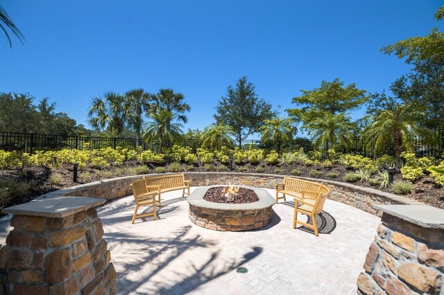 8191 Gabanna Dr, Sarasota, FL 34231 - view of patio / terrace featuring an outdoor fire pit
