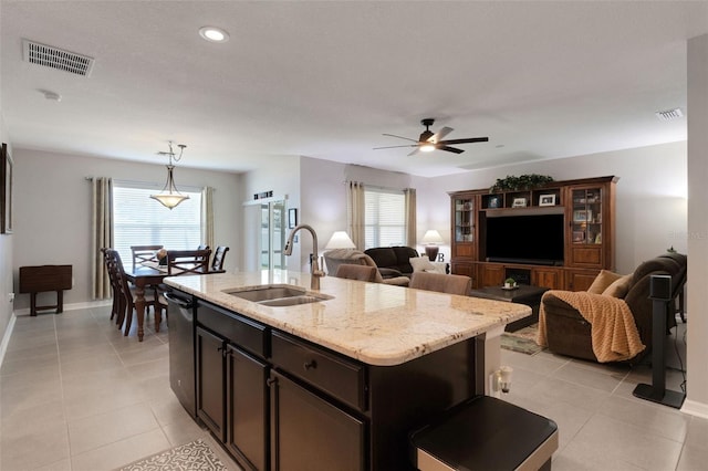 5111 11th St E, Bradenton, FL 34203 - kitchen with a sink, stainless steel dishwasher, plenty of natural light, light tile patterned floors, and recessed lighting
