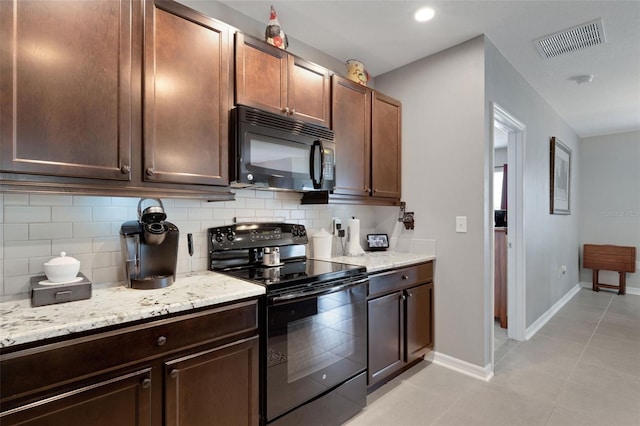 5111 11th St E, Bradenton, FL 34203 - kitchen featuring black appliances, decorative backsplash, baseboards, light tile patterned floors, and light stone counters