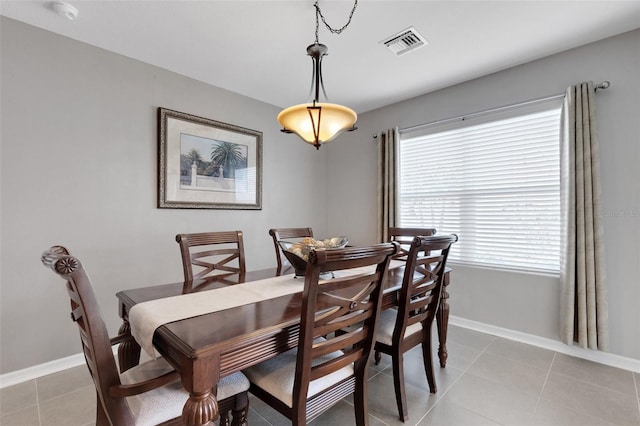 5111 11th St E, Bradenton, FL 34203 - dining room featuring baseboards and light tile patterned flooring