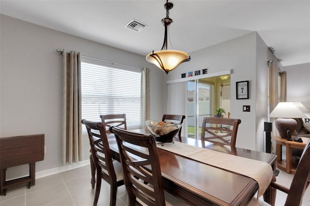 5111 11th St E, Bradenton, FL 34203 - dining space featuring light tile patterned flooring and baseboards