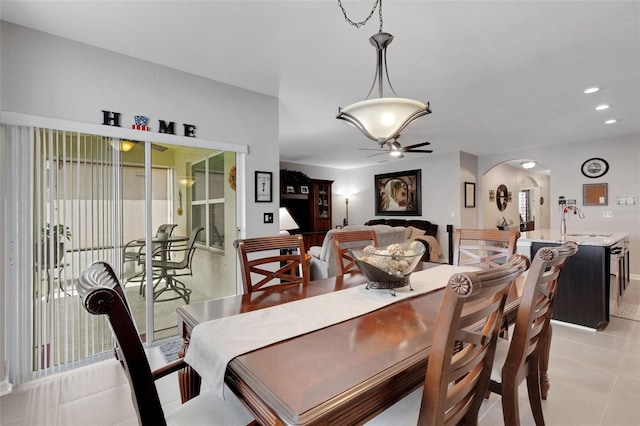 5111 11th St E, Bradenton, FL 34203 - dining room featuring arched walkways, ceiling fan, light tile patterned flooring, and recessed lighting