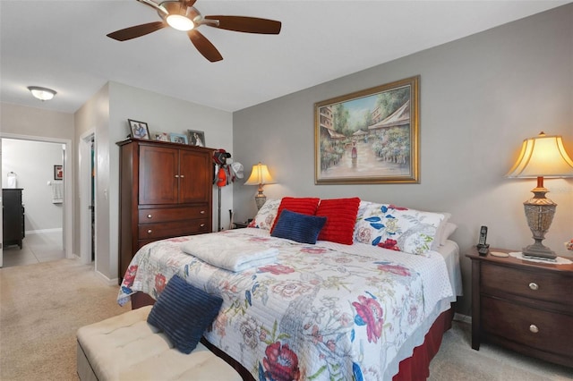 5111 11th St E, Bradenton, FL 34203 - bedroom with light carpet, baseboards, and a ceiling fan
