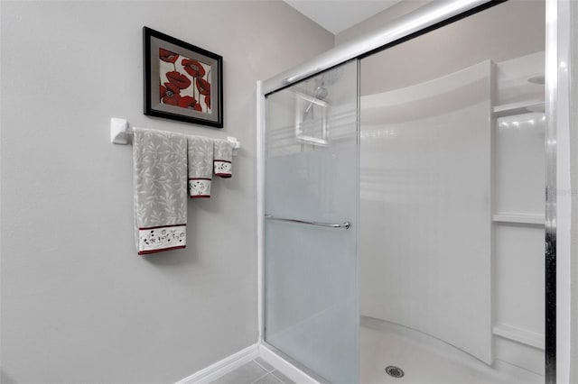 5111 11th St E, Bradenton, FL 34203 - full bathroom featuring a stall shower, baseboards, and tile patterned floors