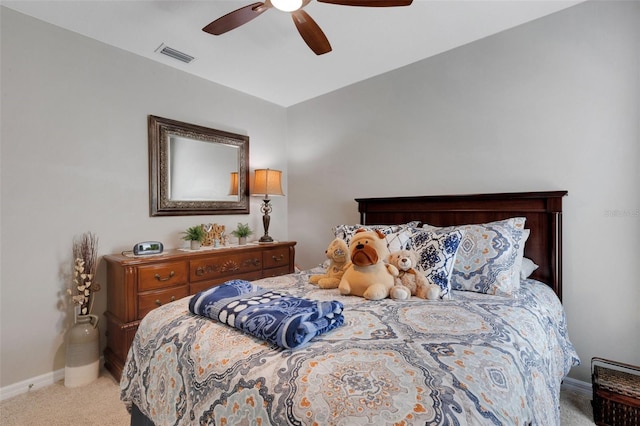 5111 11th St E, Bradenton, FL 34203 - bedroom featuring light carpet, baseboards, and ceiling fan