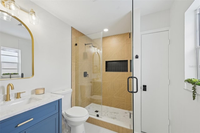 612 65th Ave W, Bradenton, FL 34207 - bathroom featuring a shower stall, vanity, toilet, and recessed lighting