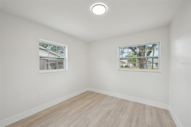 612 65th Ave W, Bradenton, FL 34207 - unfurnished room with wood finished floors and baseboards