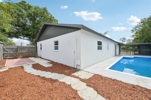 612 65th Ave W, Bradenton, FL 34207 - rear view of property with a fenced backyard, a patio area, stucco siding, and a gate