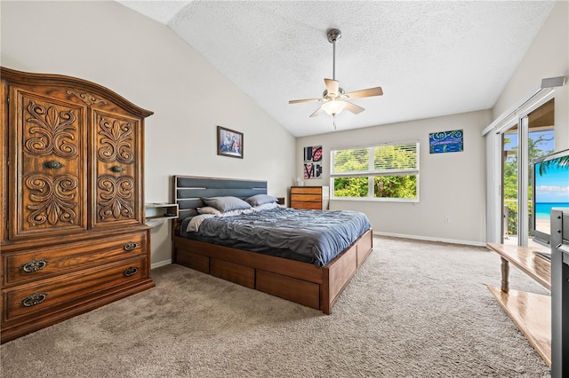 carpeted bedroom featuring access to exterior, vaulted ceiling, a textured ceiling, baseboards, and ceiling fan