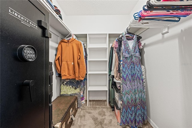 walk in closet featuring carpet