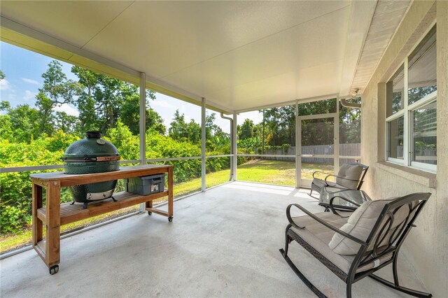 sunroom with view of scattered trees