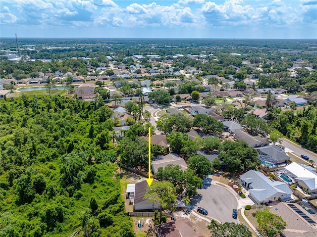aerial view of residential area with a large body of water