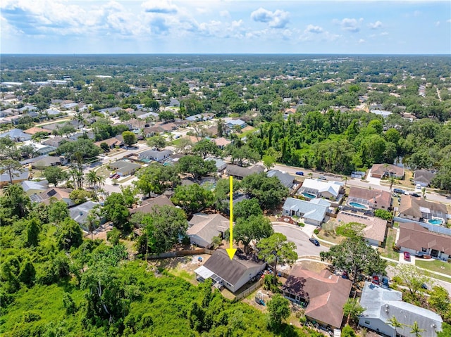 aerial view of property and surrounding area with nearby suburban area