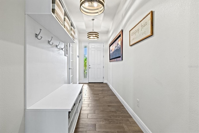 5823 Title Row Dr, Bradenton, FL 34210 - mudroom featuring dark wood-style floors, baseboards, and a chandelier
