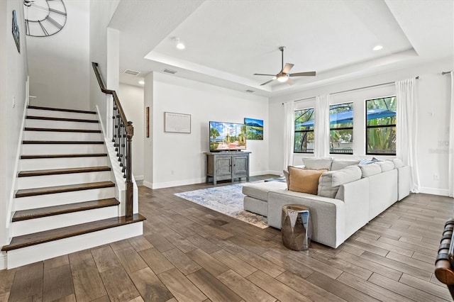 5823 Title Row Dr, Bradenton, FL 34210 - living area with a tray ceiling, a ceiling fan, wood finished floors, baseboards, and recessed lighting