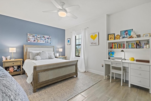5823 Title Row Dr, Bradenton, FL 34210 - bedroom featuring light wood finished floors, ceiling fan, baseboards, and an office area