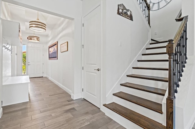 5823 Title Row Dr, Bradenton, FL 34210 - foyer entrance with wood finished floors, stairs, and a chandelier