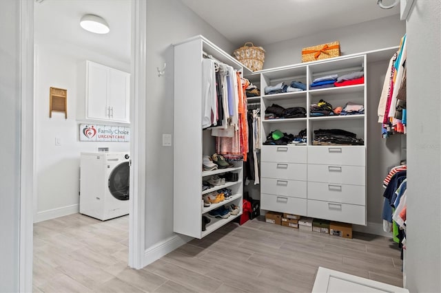 5823 Title Row Dr, Bradenton, FL 34210 - walk in closet featuring washer / clothes dryer and wood tiled floors