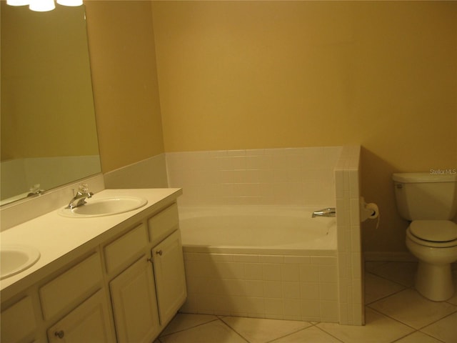 12301 Mosswood Pl, Lakewood Ranch, FL 34202 - bathroom with toilet, tile patterned flooring, a bath, and double vanity