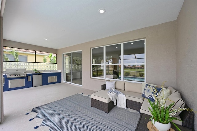 deck with grilling area and an outdoor kitchen
