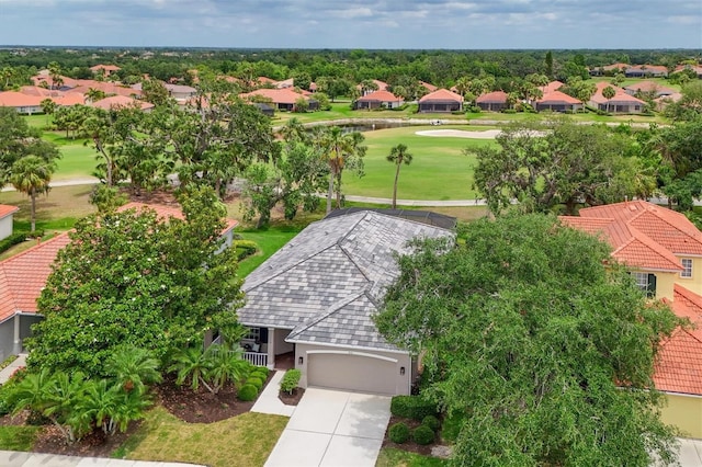aerial view of residential area featuring a golf club