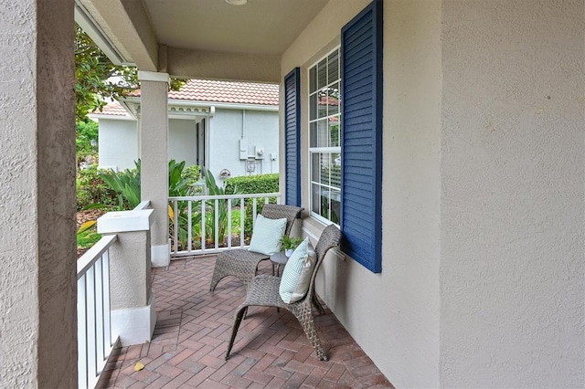 balcony featuring a porch