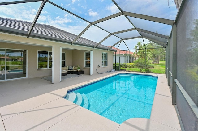 outdoor pool featuring a patio and an outdoor hangout area
