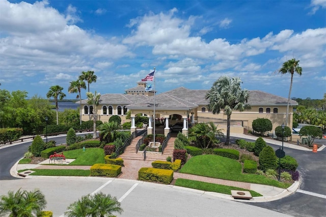 view of property's community featuring stairs and driveway