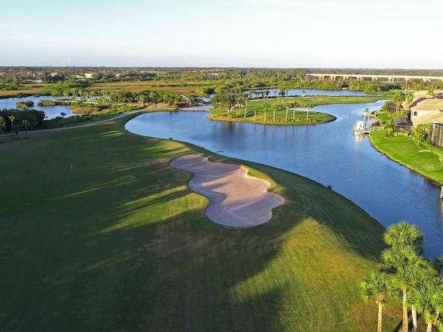 bird's eye view of a nearby body of water and a local golf course