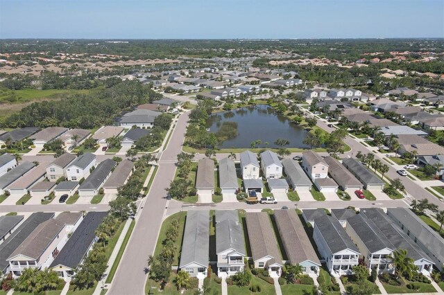 4811 Woodbrook Dr, Sarasota, FL 34243 - aerial view of property and surrounding area with nearby suburban area and a large body of water