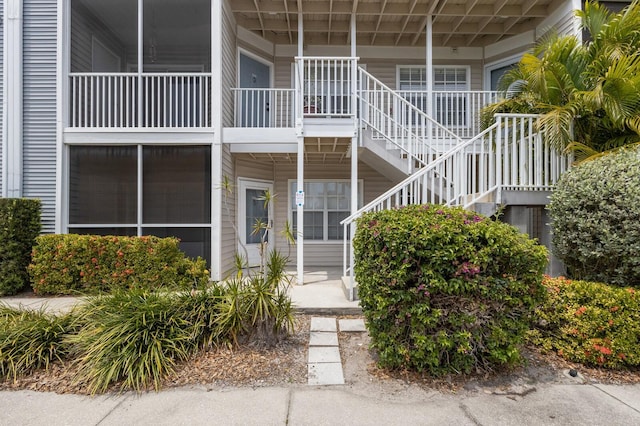 view of property featuring stairs