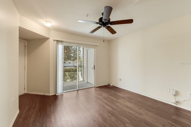 unfurnished room with wood finished floors, baseboards, and a ceiling fan