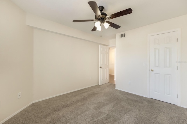 unfurnished bedroom with carpet floors, baseboards, and ceiling fan
