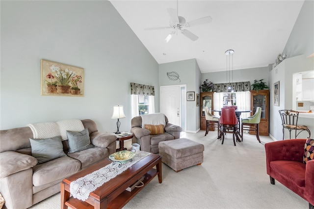 7637 Sweetbay Cir, Bradenton, FL 34203 - living room with high vaulted ceiling, light carpet, baseboards, and ceiling fan